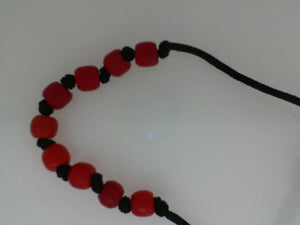 YY red bead on black cord bracelet