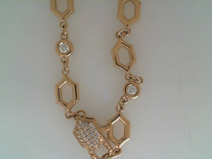 Erica Courtney 18k yellow gold bezel set diamond and hexagon shaped ch