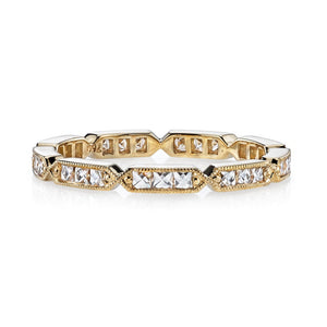 Segments of three square diamonds set in gold form band 
