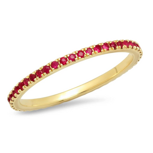 Thin gold band wrapped in row of red rubies