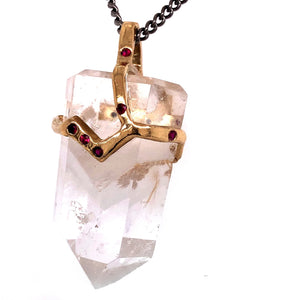 Clear quartz crystal attached to necklace by handmade gold "crown" that also features inset gems