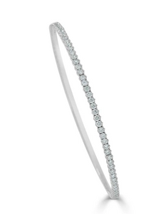 thin White gold bangle like bracelet is covered by a single row of white diamonds