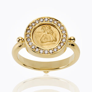 Gold ring with angel image surrounded by diamonds on top