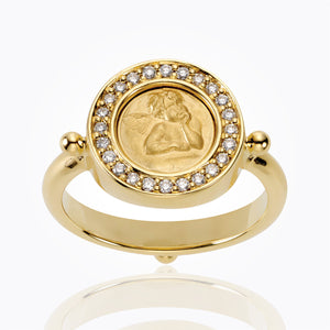 Gold ring with angel image surrounded by diamonds on top